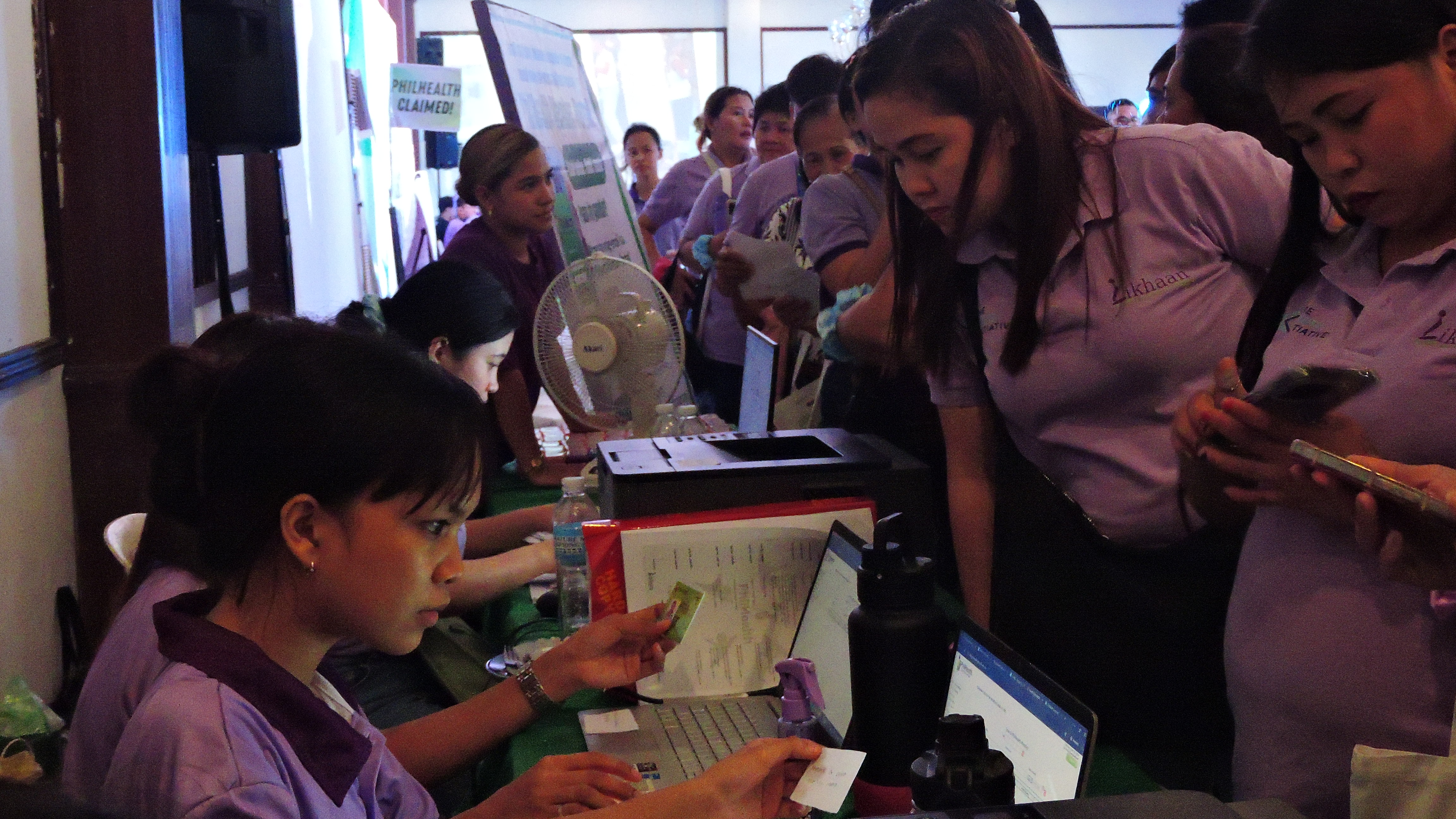 4 Fair pax checking names on PhilHealth cloud.JPG